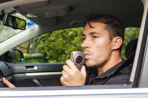 Man blowing into breathalyzer